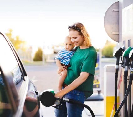 parent fuelling car with redkites financial assistance program offering financial help for cancer patients and their families